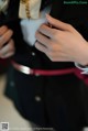 A close up of a person wearing a suit and tie.